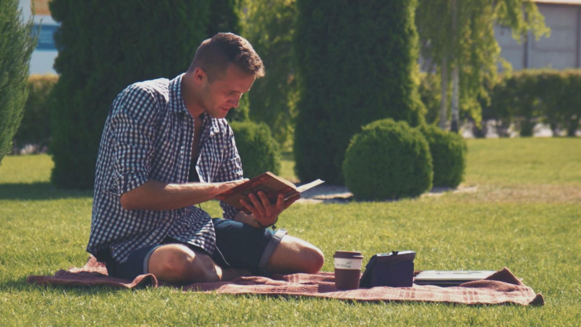 A person reviewing fiction genre content on a laptop, preparing a support request